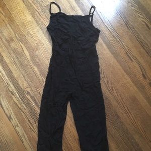 Black jumpsuit with cut-out middle section.